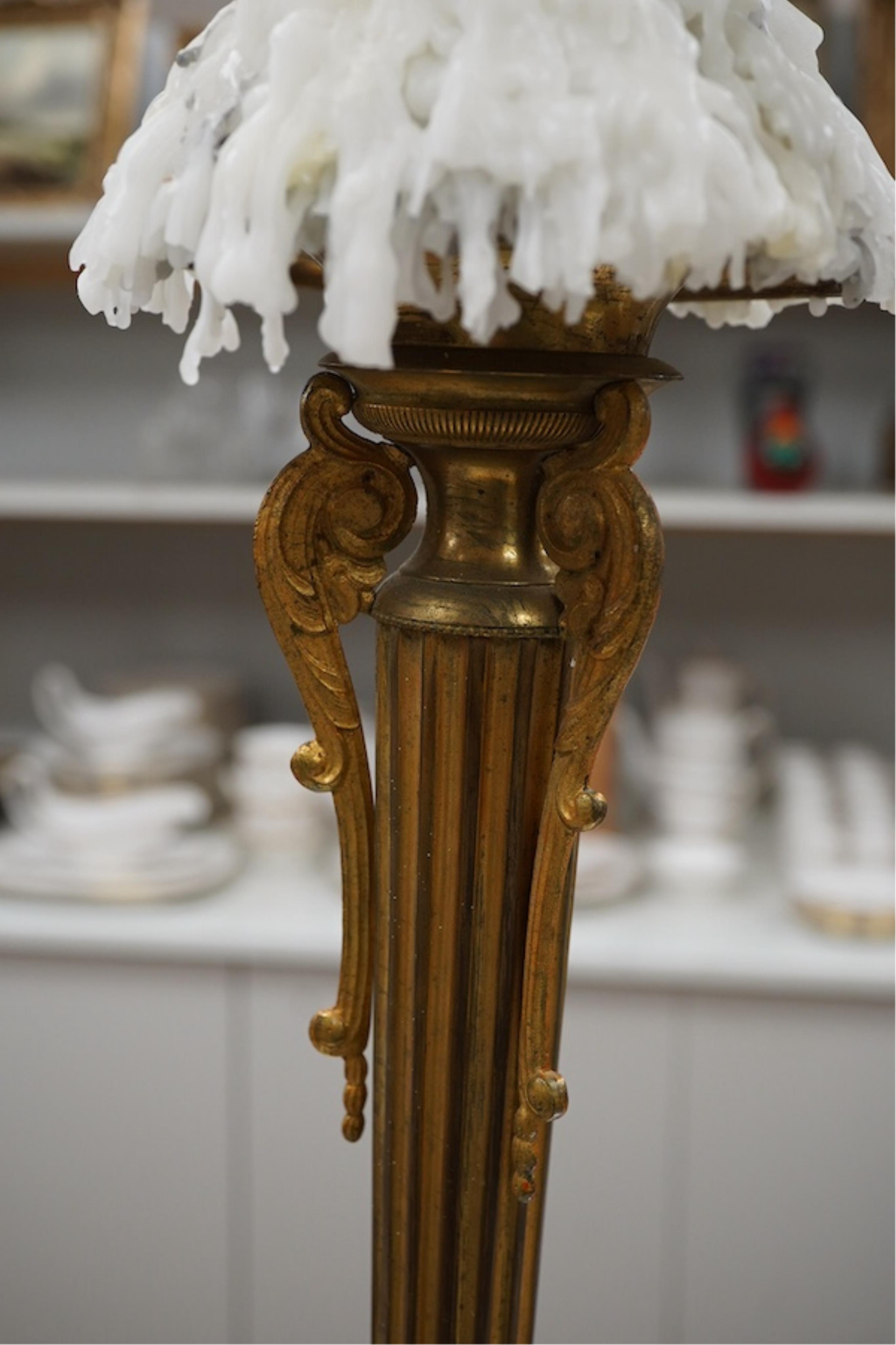 A brass column candlestick, 73cm